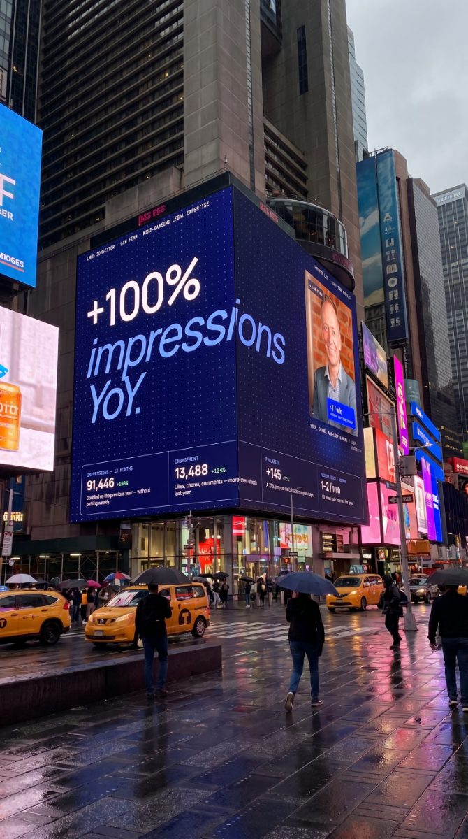 LM&DS on a Times Square billboard reading '+100% impressions YoY.'